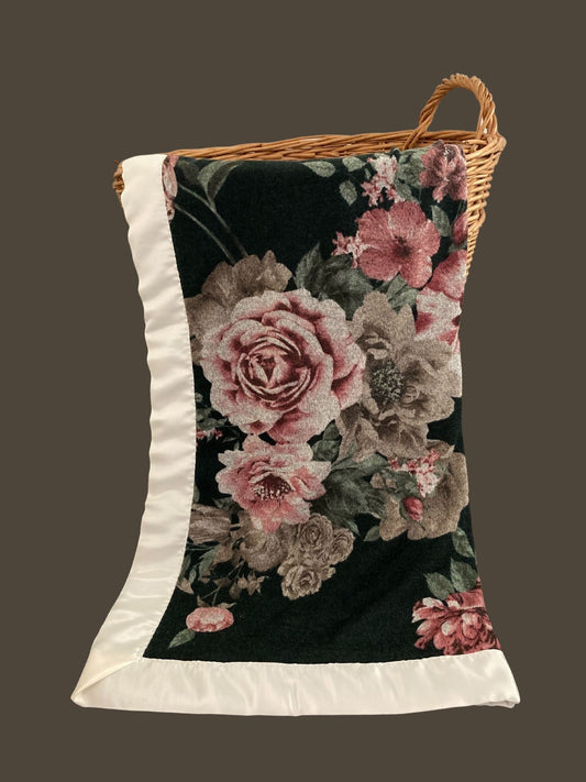 B.C JAMES CO. Floral baby blanket with an off-white silk boarder