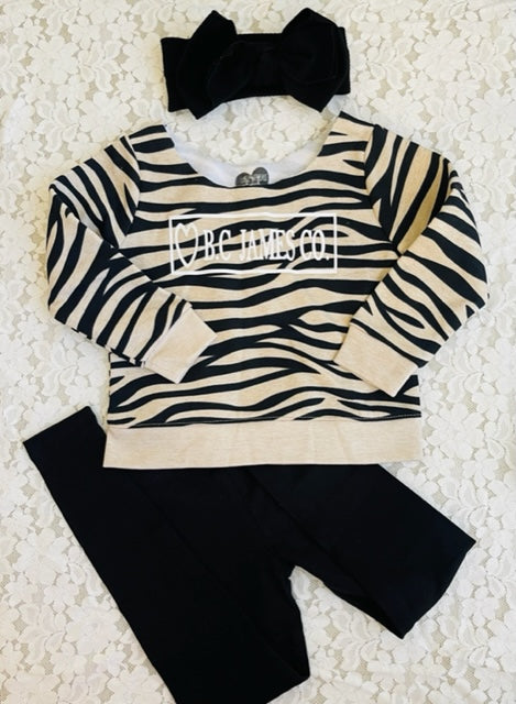 B.C JAMES Off the shoulder zebra sweater with black leggings and Black Headband